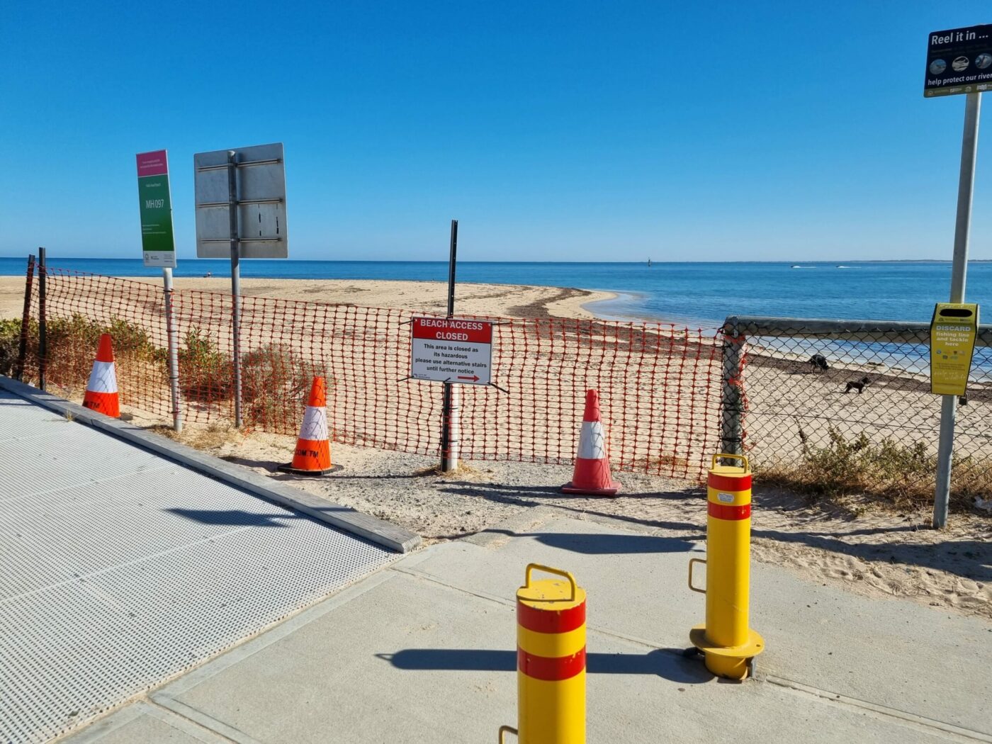 Signs and temporary fencing and danger tape to close the beach